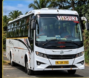 Luxury tourist bus coach for group pilgrimage travel in Subramanya
